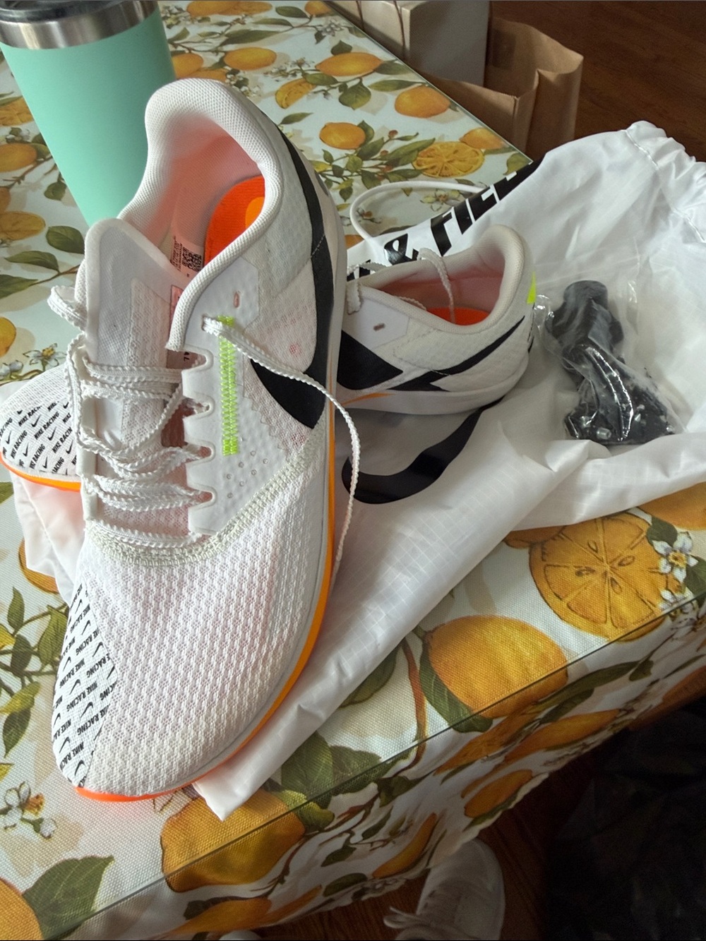 Nike men’s 10.5 track White Running Shoes with Orange and Neon Green Accents